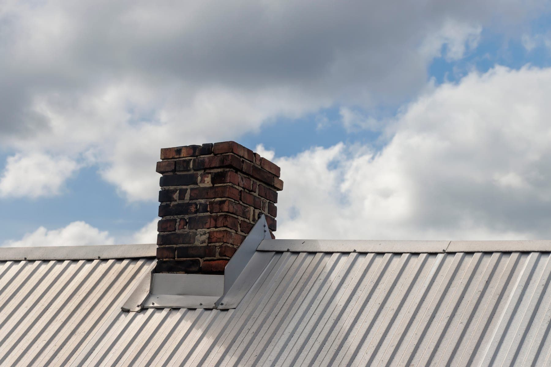 Chimney flashing on a metal roof