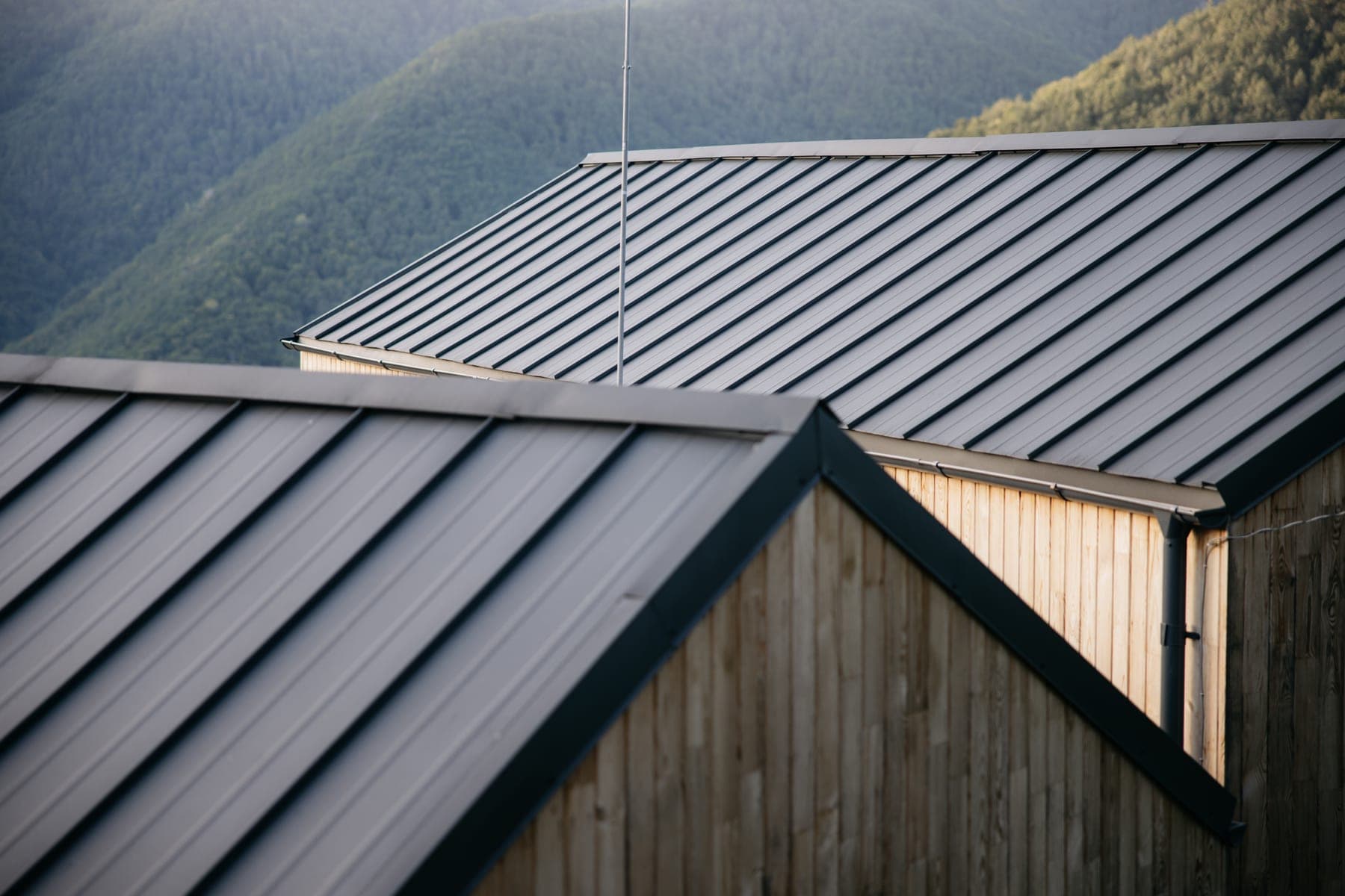Dark standing seam metal roof on a house